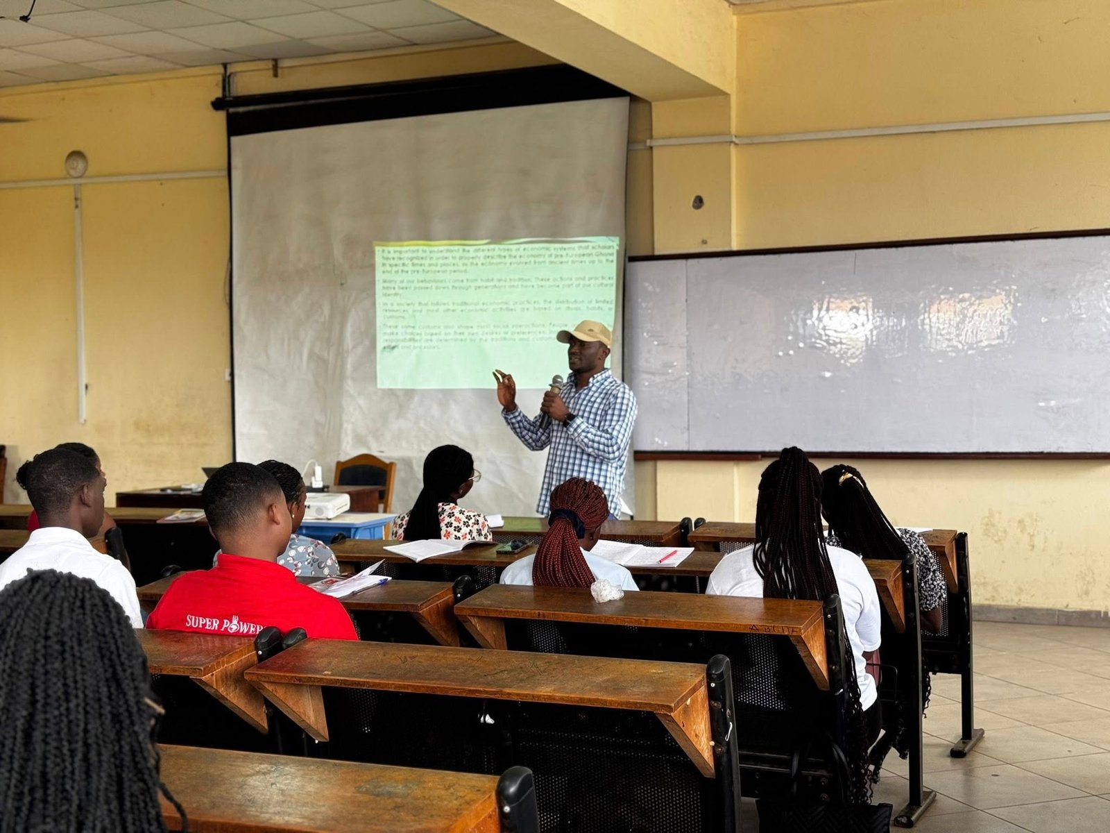 Mr. Emmanuel John Awine speaking at UCC